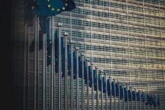 blue flag on top of building during daytime