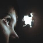 person watching through hole