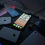 black iphone 4 on black table