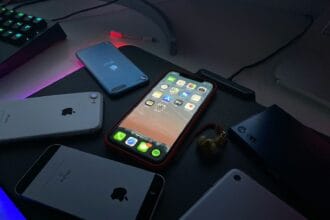 black iphone 4 on black table