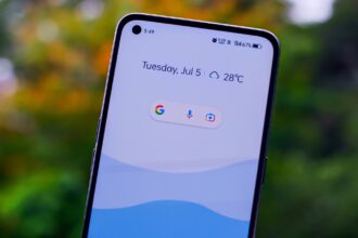 a close up of a person holding a cell phone