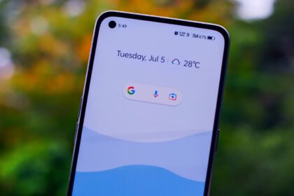 a close up of a person holding a cell phone