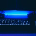 a computer desk with a keyboard and mouse