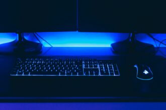 a computer desk with a keyboard and mouse