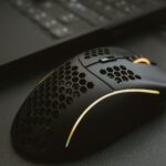 black and yellow logitech computer mouse