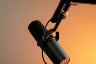 black and silver microphone on brown wall