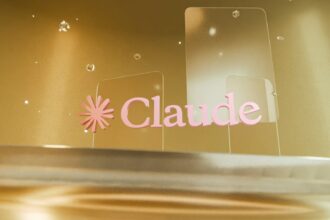 Pink "claude" logo on clear panels against a golden background