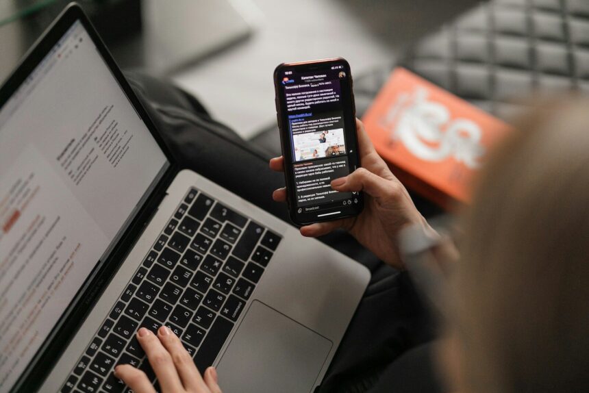 person holding black iphone 4